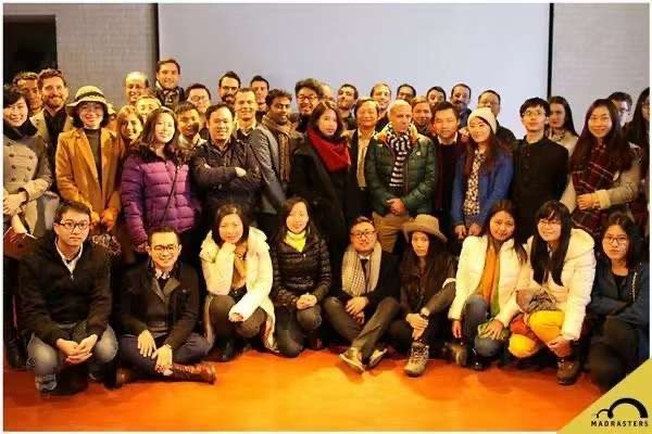 A large meetup group posing together