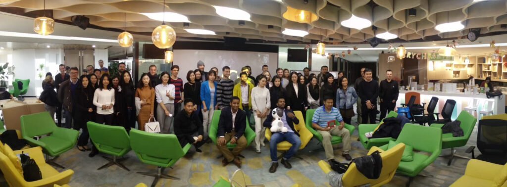 A panoramic view of Madrasters members gathered in a larger meetup venue