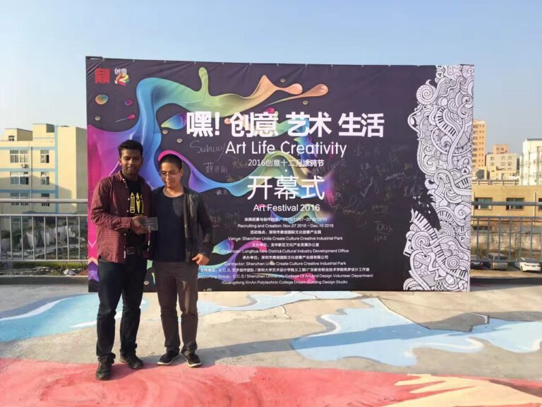 Two people at an outdoor art and design event
