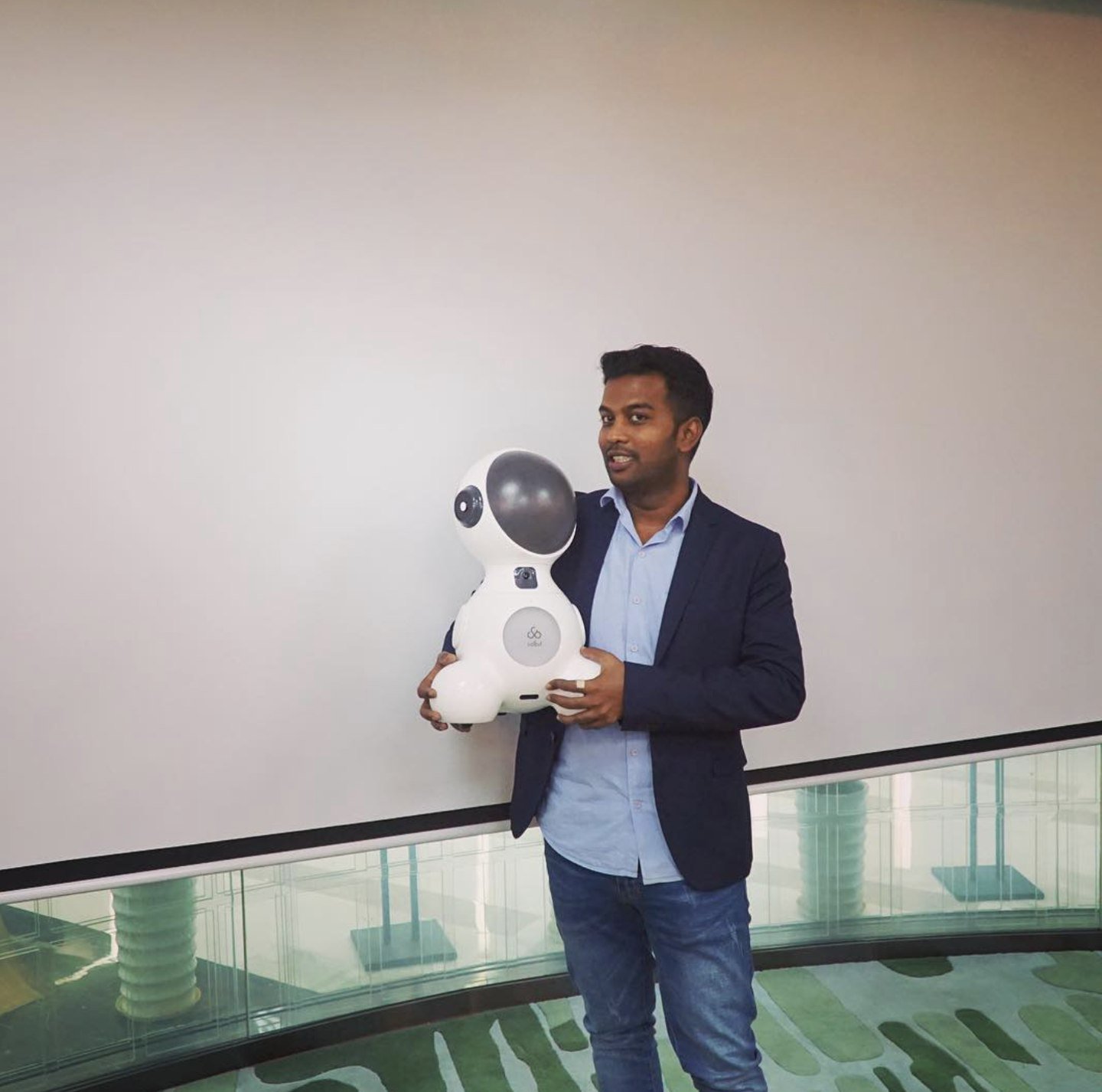 Saravana holding Solbit at a technology event in Shenzhen